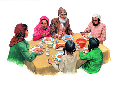 A Muslim family celebrates the end of Ramadan, which is marked by the Islamic festival of Eid al-Fitr.